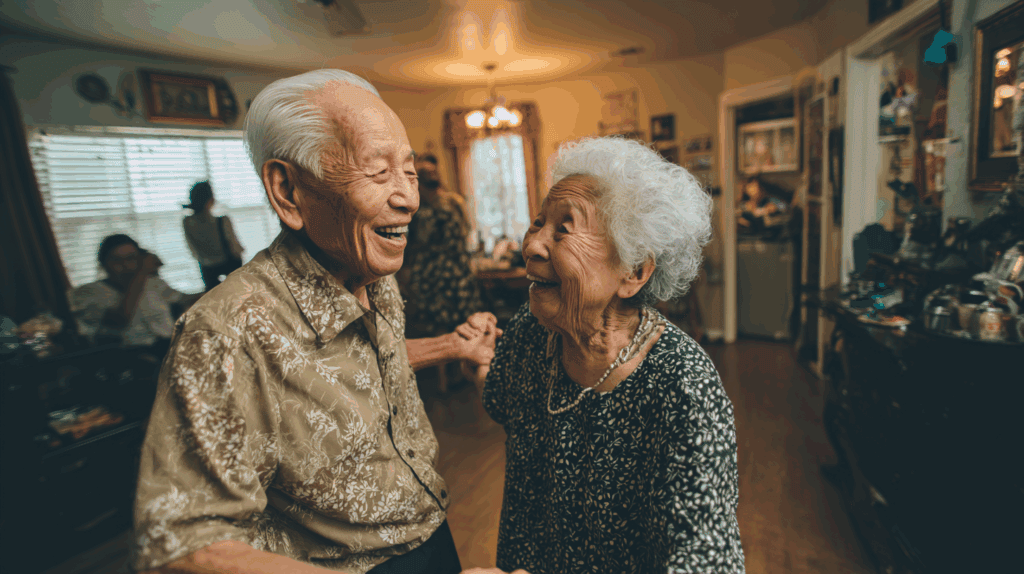 Elderly couple laughing and dancing together at home, illustrating low-impact dancing as a joyful cardio workout for aging joints